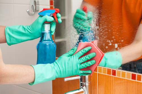 Local cleaning specialist treating a fresh spill in a Highbury home