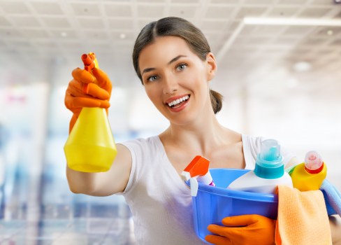 Cleaner preparing a guest-ready bedroom in a Highbury rental property
